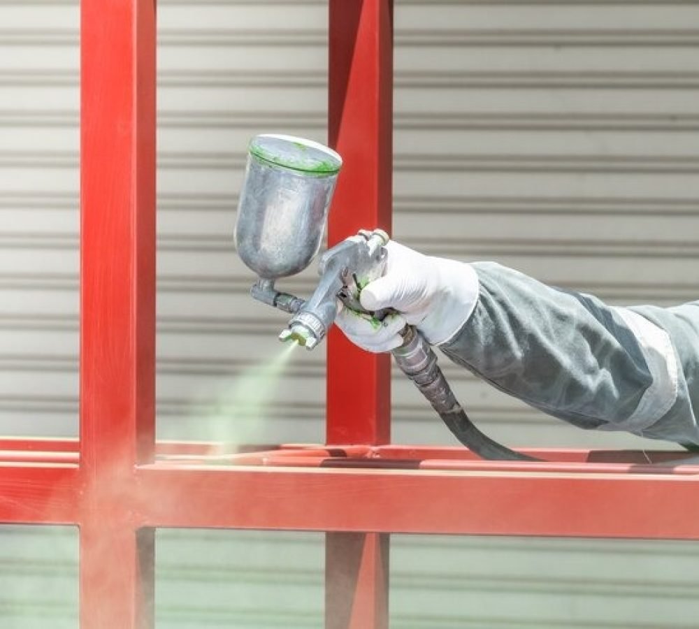 imgi_195_workers-spraying-paint-metal-work_41629-41