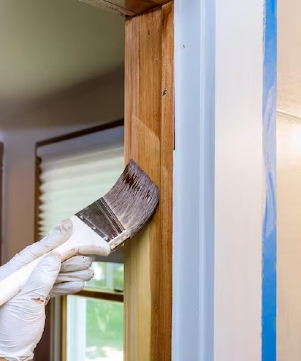 imgi_31_woman-holding-umbrella-standing-against-door_1048944-4026515